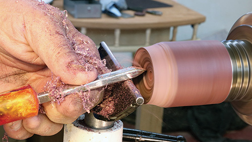 Carving spinning top base with a skew chisel