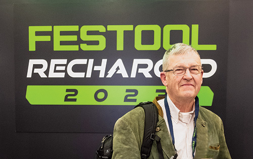 Ernie Conover in front of Festool Recharged event banner