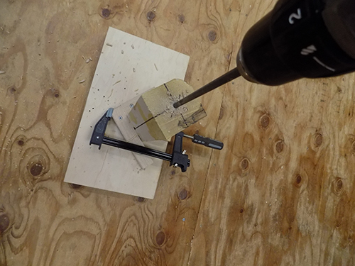 Using shop-made jig for drilling lamp spindle center hole