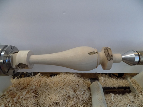 Fully turned lamp spindle mounted on lathe