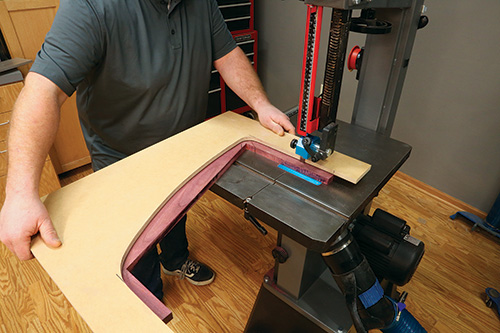 Cutting away excess shelf blank with band saw