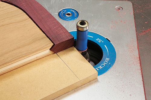 Close-up of double bearing flush trim bit in router table