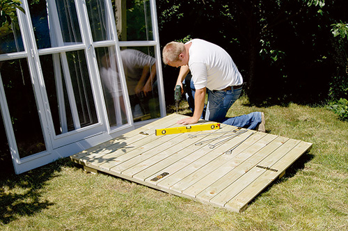 Checking ground flatness under fold-up greenhouse base