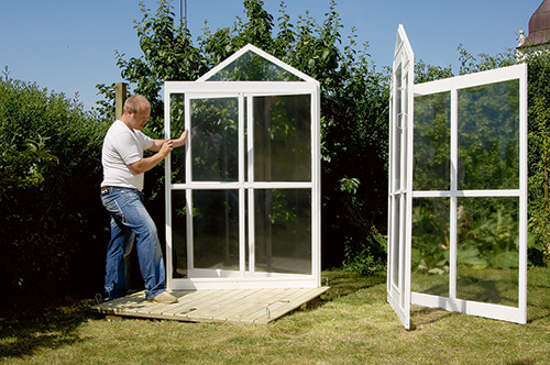 Fastening fold-up greenhouse sides and front on decking platform