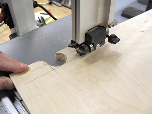 Cutting rough handle cutout for folding shop desk with jigsaw