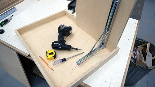Installing shelf brackets on folding shop desk panels