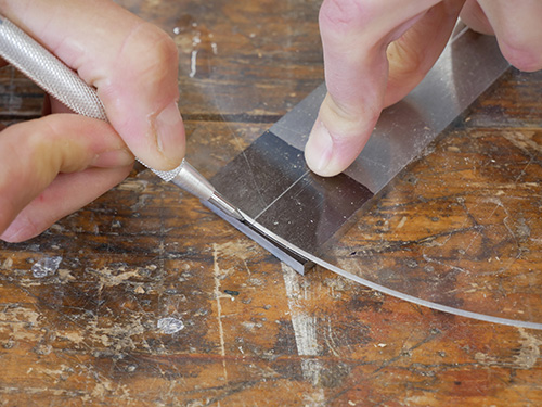 Marking plane blade with a marking tool