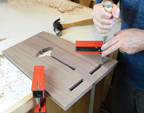 Cleaning out table panel mortise with a chisel