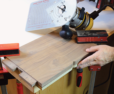 Notch cut into side of table shelf with router