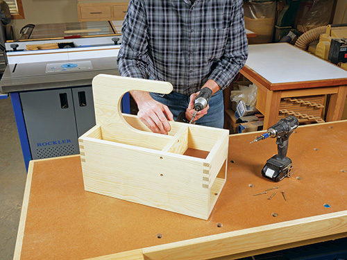 Attaching handle assembly to top of glue caddy carcass