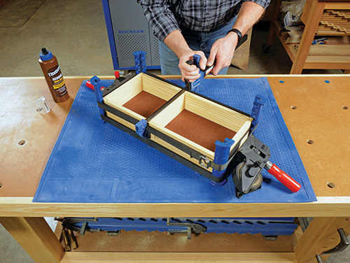 Clamping drawer assembly for glue caddy