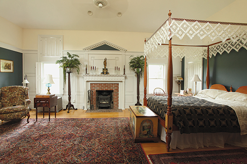 This photo of the author's home shows a fireplace wall in the Greek Revival style. The columns are purely ornamental but carry the Greek Revival theme.