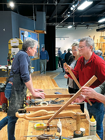 Examining chair parts during a class