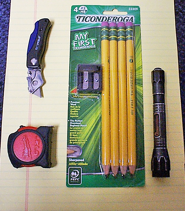Workshop tape measure, knife, pencils and flashlight