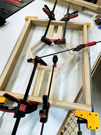 Clamping up full tall table legs