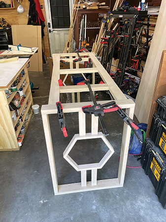 Gluing and clamping tall table bottom assembly