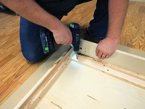Attaching bed frame assembly to base panel