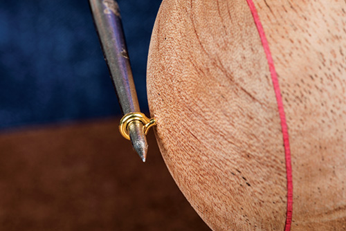 Adding screw eye by turning with an awl