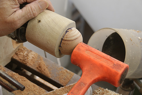 Refitting blank in cup chuck with hammer