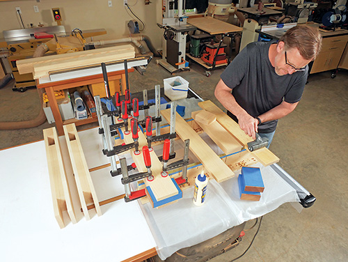 Gluing up leg pieces for hybrid workbench