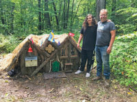 Jerry Carlson and his son Cyrus with a elf house