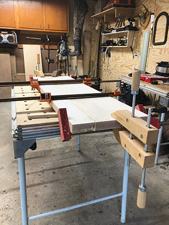 Clamping maple boards together to create bench seat