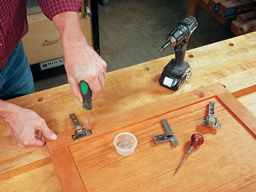 Drilling holes for European hinge installation on cabinet door