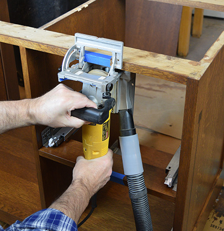 Cutting biscuit slot in Limbert hutch cabinet frame