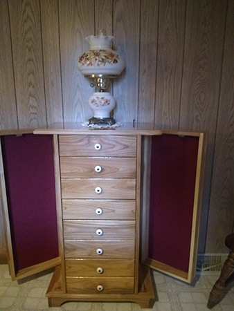 Jewelry cabinet with both side panels open