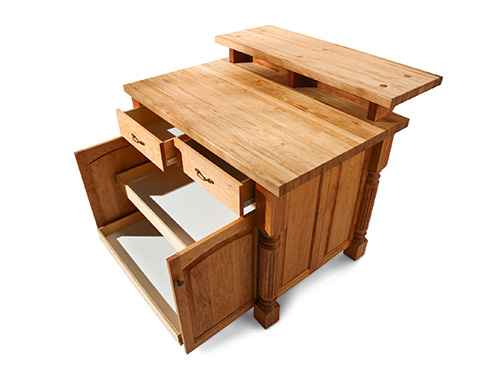 Kitchen island with drawers and slide-out section opened