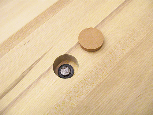 Bolt and washer installed in kitchen island countertop