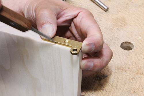 Marking hinge edges on cabinet door panel