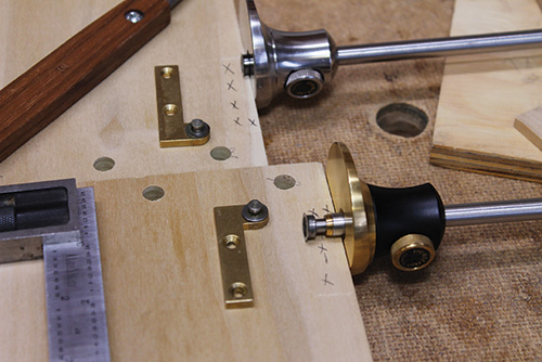 Plotting out mortises on cabinet carcass with a marking gauge