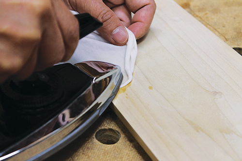 Ironing out dents in wooden cabinet panel