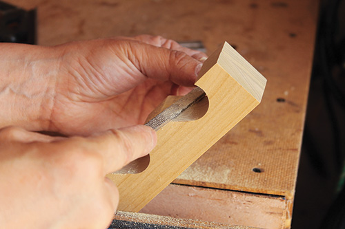 Filing down chisel tool holder for shop cabinet