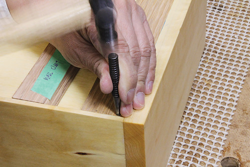 Screwing a French cleat into shop cabinet side rabbet