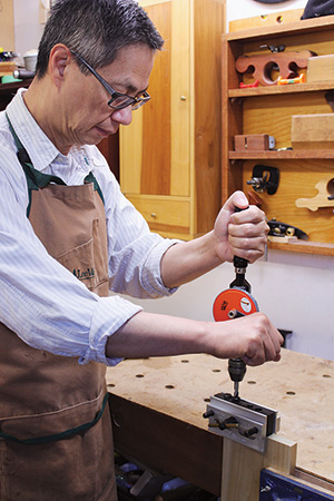 Charles Mak using a doweling jig