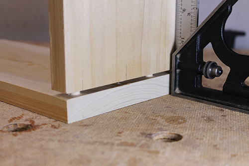 Fitting cabinet parts with dowel pins