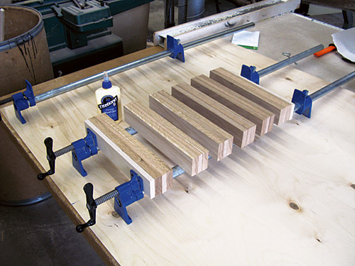 Clamping kubb game pieces together with glue and bar clamps