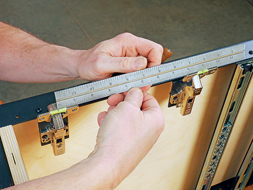 Laying out hinge installation position on shop cabinet door