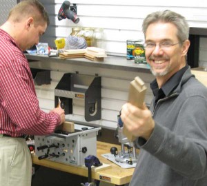 Rob Johnstone checks out Matthew Grisley’s work at an in-shop demonstration for Woodworker’s Journal.