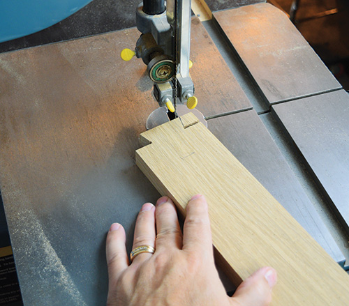 Marking and cutting Limbert hutch side rail dovetails on a band saw