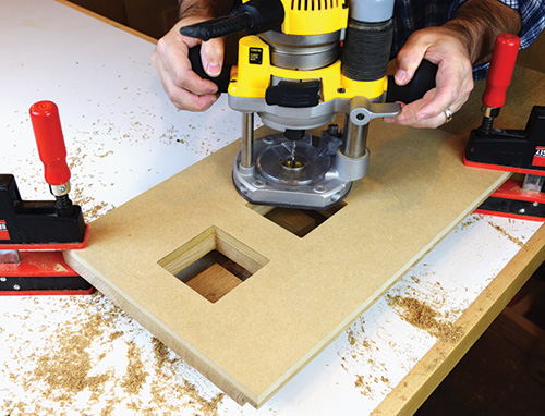 Cutting Limbert hutch using plywood template and plunge router