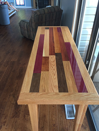 Long side table next to a sliding glass door