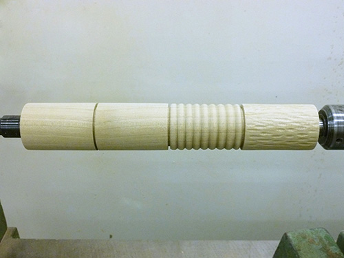 Spindle turned on a lathe ready for finish