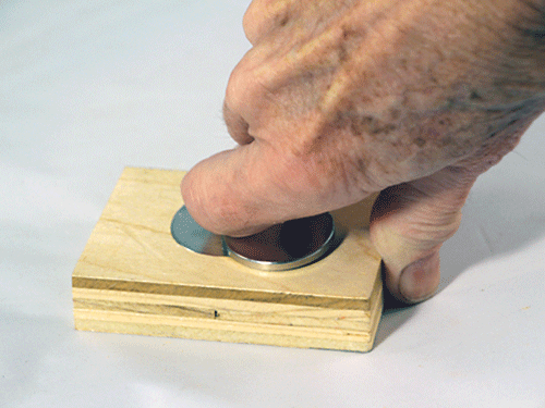 Separating two stuck magnets with plywood jig