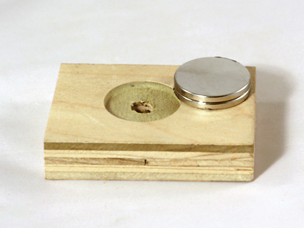 Two magnets stacked on a separator jig