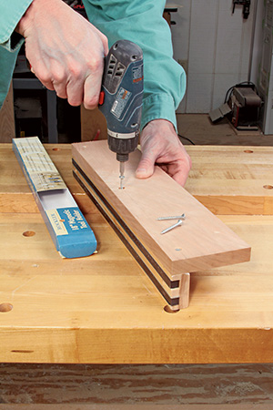 Attaching magnetic strip to scrap fence