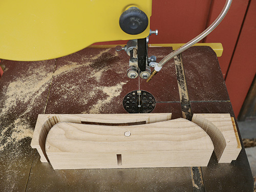Cutting away wooden hand plane body with a bandsaw