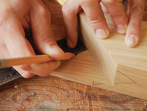 Marking centerpoint for dowel pin on wooden plane